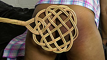 carpet beater on Dani's bum